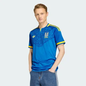 Areena Design <p>Show your support for Ukraine with the <strong>FIFA World Cup Ukraine 2026 Away Authentic Jersey</strong>. This authentic jersey features Ukraine’s official away colors and crest, offering a perfect blend of style, comfort, and performance. Made with high-quality materials for an elite fit, it’s the ultimate way for passionate fans to cheer on Ukraine during the 2026 World Cup.</p> FIFA World Cup Ukraine 2026 Away Authentic Jersey <p>Show your support for Ukraine with the <strong>FIFA World Cup Ukraine 2026 Away Authentic Jersey</strong>. This authentic jersey features Ukraine’s official away colors and crest, offering a perfect blend of style, comfort, and performance. Made with high-quality materials for an elite fit, it’s the ultimate way for passionate fans to cheer on Ukraine during the 2026 World Cup.</p>