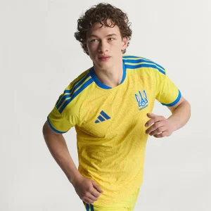 FIFA World Cup Ukraine 2026 Home Jersey <p>Cheer on Ukraine in the <strong>FIFA World Cup Ukraine 2026 Home Jersey</strong>. This jersey showcases Ukraine's vibrant national colors and crest, offering both style and comfort. Made with high-quality materials, it's the perfect choice for passionate fans looking to support their team in the 2026 World Cup with confidence and pride.</p>