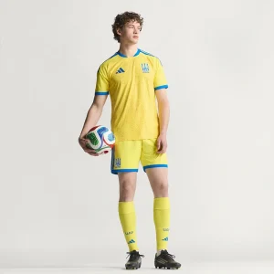 Areena Design <p>Cheer on Ukraine in the <strong>FIFA World Cup Ukraine 2026 Home Jersey</strong>. This jersey showcases Ukraine's vibrant national colors and crest, offering both style and comfort. Made with high-quality materials, it's the perfect choice for passionate fans looking to support their team in the 2026 World Cup with confidence and pride.</p> FIFA World Cup Ukraine 2026 Home Jersey <p>Cheer on Ukraine in the <strong>FIFA World Cup Ukraine 2026 Home Jersey</strong>. This jersey showcases Ukraine's vibrant national colors and crest, offering both style and comfort. Made with high-quality materials, it's the perfect choice for passionate fans looking to support their team in the 2026 World Cup with confidence and pride.</p>