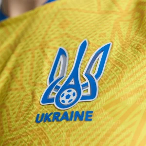 Areena Design <p>Cheer on Ukraine in the <strong>FIFA World Cup Ukraine 2026 Home Jersey</strong>. This jersey showcases Ukraine's vibrant national colors and crest, offering both style and comfort. Made with high-quality materials, it's the perfect choice for passionate fans looking to support their team in the 2026 World Cup with confidence and pride.</p> FIFA World Cup Ukraine 2026 Home Jersey <p>Cheer on Ukraine in the <strong>FIFA World Cup Ukraine 2026 Home Jersey</strong>. This jersey showcases Ukraine's vibrant national colors and crest, offering both style and comfort. Made with high-quality materials, it's the perfect choice for passionate fans looking to support their team in the 2026 World Cup with confidence and pride.</p>