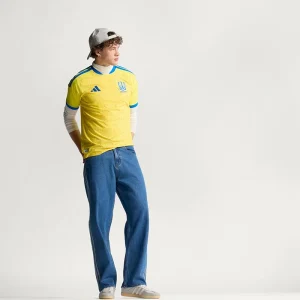 Areena Design <p>Cheer on Ukraine in the <strong>FIFA World Cup Ukraine 2026 Home Jersey</strong>. This jersey showcases Ukraine's vibrant national colors and crest, offering both style and comfort. Made with high-quality materials, it's the perfect choice for passionate fans looking to support their team in the 2026 World Cup with confidence and pride.</p> FIFA World Cup Ukraine 2026 Home Jersey <p>Cheer on Ukraine in the <strong>FIFA World Cup Ukraine 2026 Home Jersey</strong>. This jersey showcases Ukraine's vibrant national colors and crest, offering both style and comfort. Made with high-quality materials, it's the perfect choice for passionate fans looking to support their team in the 2026 World Cup with confidence and pride.</p>