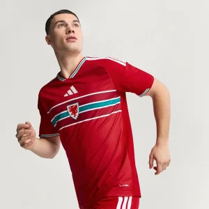 FIFA World Cup Wales 2026 Home Authentic Jersey <p>Cheer on your team in style with the <strong>FIFA World Cup Wales 2026 Home Authentic Jersey</strong>. Featuring an iconic design inspired by Wales’ legendary home look, this jersey combines a lightweight feel and athletic fit, perfect for match days, training, or everyday fan wear.</p>