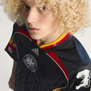 Areena Design <p>A remixed Germany jersey featuring creative design cues and comfortable performance fabric for casual and fan wear.</p> Mens Bringback Remixed Germany Jersey <p>A remixed Germany jersey featuring creative design cues and comfortable performance fabric for casual and fan wear.</p>