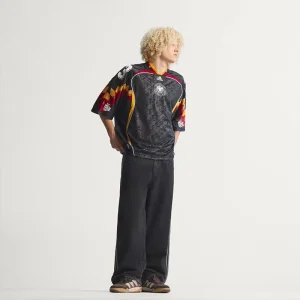 Areena Design <p>A remixed Germany jersey featuring creative design cues and comfortable performance fabric for casual and fan wear.</p> Mens Bringback Remixed Germany Jersey <p>A remixed Germany jersey featuring creative design cues and comfortable performance fabric for casual and fan wear.</p>