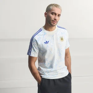 Areena Design <p>Adidas Argentina Originals All Over Print T-Shirt brings sports and fanwear styling to a comfortable shirt made for game days, fan events, training-inspired outfits, and casual weekends. Easy to style and strong for casual, fan, and streetwear outfits.</p> Adidas Argentina Originals All Over Print T-Shirt <p>Adidas Argentina Originals All Over Print T-Shirt brings sports and fanwear styling to a comfortable shirt made for game days, fan events, training-inspired outfits, and casual weekends. Easy to style and strong for casual, fan, and streetwear outfits.</p>