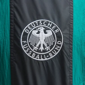 Areena Design <p><strong>Adidas FIFA World Cup 26 Germany EQT Track Top</strong> brings football-inspired style into match days, casual outfits, travel and gifting. Pair it with denim, cargos, joggers, track pants or clean sneakers for an easy supporter look.</p> Adidas FIFA World Cup 26 Germany EQT Track Top <p><strong>Adidas FIFA World Cup 26 Germany EQT Track Top</strong> brings football-inspired style into match days, casual outfits, travel and gifting. Pair it with denim, cargos, joggers, track pants or clean sneakers for an easy supporter look.</p>