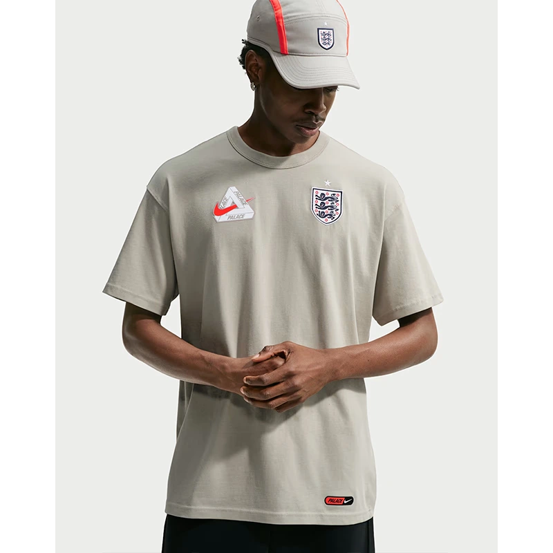 England x Palace Grey T-Shirt 1 England x Palace Grey T-Shirt <p>England x Palace Grey T-Shirt adds an easy everyday top to your wardrobe with clean, versatile styling. It is ideal for casual outfits, training-inspired looks, layered streetwear, and warm-weather styling.</p>