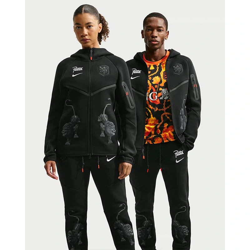 Netherlands x Patta Tech Fleece Full-Zip Windrunner Hoodie 3 Netherlands x Patta Tech Fleece Full-Zip Windrunner Hoodie <p>Netherlands x Patta Tech Fleece Full-Zip Windrunner Hoodie brings a bold outerwear look to casual and streetwear outfits. Wear it for daily layering, night-out outfits, travel looks, and streetwear styling.</p>