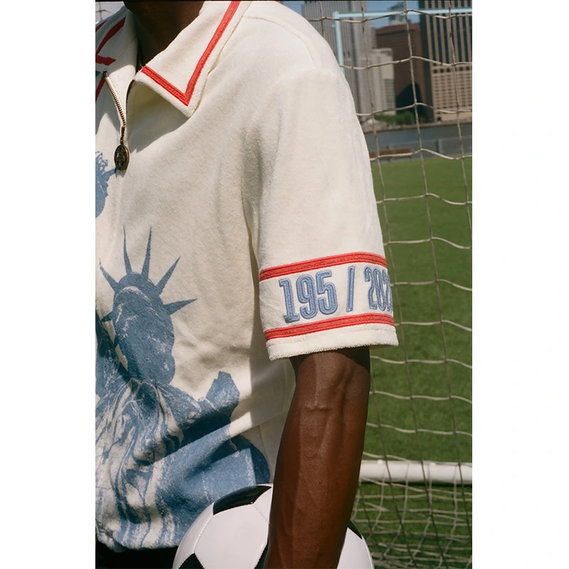 Tombolo FIFA World Cup 2026 Liberty Cabana (Captain’s Armband) Zipper Shirt 6 Tombolo FIFA World Cup 2026 Liberty Cabana (Captain's Armband) Zipper Shirt <p><strong>Tombolo FIFA World Cup 2026 Liberty Cabana (Captain's Armband) Zipper Shirt</strong> brings football-inspired style into match days, casual outfits, travel and gifting. Pair it with shorts, denim, cargos, track pants or a light overshirt for an easy supporter look.</p>