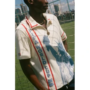 Areena Design <p><strong>Tombolo FIFA World Cup 2026 Liberty Cabana (Captain's Armband) Zipper Shirt</strong> brings football-inspired style into match days, casual outfits, travel and gifting. Pair it with shorts, denim, cargos, track pants or a light overshirt for an easy supporter look.</p> Tombolo FIFA World Cup 2026 Liberty Cabana (Captain's Armband) Zipper Shirt <p><strong>Tombolo FIFA World Cup 2026 Liberty Cabana (Captain's Armband) Zipper Shirt</strong> brings football-inspired style into match days, casual outfits, travel and gifting. Pair it with shorts, denim, cargos, track pants or a light overshirt for an easy supporter look.</p>