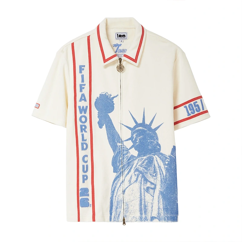 Tombolo FIFA World Cup 2026 Liberty Cabana (Captain’s Armband) Zipper Shirt Tombolo FIFA World Cup 2026 Liberty Cabana (Captain's Armband) Zipper Shirt <p><strong>Tombolo FIFA World Cup 2026 Liberty Cabana (Captain's Armband) Zipper Shirt</strong> brings football-inspired style into match days, casual outfits, travel and gifting. Pair it with shorts, denim, cargos, track pants or a light overshirt for an easy supporter look.</p>