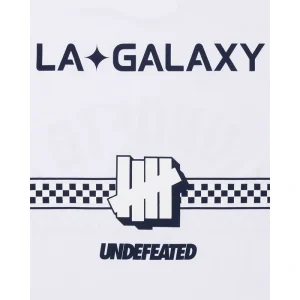 Areena Design <p>UNDEFEATED X USSF X MLS LA GALAXY WHITE TEE delivers graphic fan style with easy everyday wearability, inspired by U.S. Soccer federation culture and LA Galaxy supporter culture. A versatile tee for match days, streetwear looks, travel and everyday casual wear.</p> UNDEFEATED X USSF X MLS LA GALAXY WHITE TEE <p>UNDEFEATED X USSF X MLS LA GALAXY WHITE TEE delivers graphic fan style with easy everyday wearability, inspired by U.S. Soccer federation culture and LA Galaxy supporter culture. A versatile tee for match days, streetwear looks, travel and everyday casual wear.</p>