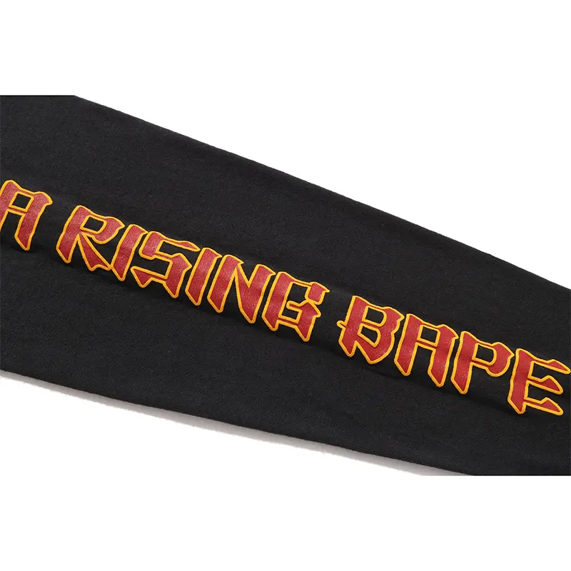 A RISING BAPE Black Tee 4 A RISING BAPE Black Tee <p><strong>A RISING BAPE Black Tee</strong> delivers a casual statement t-shirt look for streetwear outfits, relaxed days, travel, and everyday wear. Its distinctive design offers easy outfit pairing, versatile styling, and standout graphic appeal, making it a strong choice for personal wardrobes, collections, or gifting.</p>