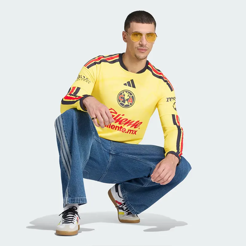 Adidas Club America 26-27 Home Jersey Long Sleeve 4 Adidas Club America 26/27 Home Jersey Long Sleeve <p><strong>Adidas Club America 26/27 Home Jersey Long Sleeve</strong> delivers a sport-inspired jersey look for game-day outfits, fan styling, casual wear, and sports-themed events. Its distinctive design offers team-inspired appeal, easy casual pairing, and energetic visual identity, making it a strong choice for personal wardrobes, collections, or gifting.</p>