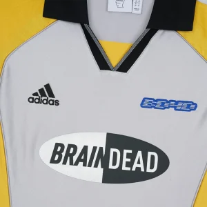 Areena Design <p><strong>Brain Dead x Adidas Short Sleeve Jersey</strong> delivers a sport-inspired jersey look for game-day outfits, fan styling, casual wear, and sports-themed events. Its distinctive design offers team-inspired appeal, easy casual pairing, and energetic visual identity, making it a strong choice for personal wardrobes, collections, or gifting.</p> Brain Dead x Adidas Short Sleeve Jersey <p><strong>Brain Dead x Adidas Short Sleeve Jersey</strong> delivers a sport-inspired jersey look for game-day outfits, fan styling, casual wear, and sports-themed events. Its distinctive design offers team-inspired appeal, easy casual pairing, and energetic visual identity, making it a strong choice for personal wardrobes, collections, or gifting.</p>
