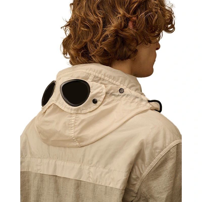C.P. Company Rafia-R Mixed Dove Goggle Jacket 2 C.P. Company Rafia-R Mixed Dove Goggle Jacket <div class="product-short-description"><p>Shop the C.P. Company Rafia-R Mixed Dove Goggle Jacket, a standout jacket shaped by C.P. Company utility design and signature goggle detailing. It stands out with signature goggle-inspired utility styling. Easy to style, it brings a distinctive collaborative edge to casual outfits.</p></div>