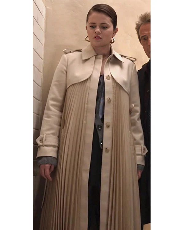 18 Only Murders in the Building S04 Selena Gomez Pleated Coat <strong>Product Specification</strong> <ul> <li>Material: Cotton Material</li> <li>Internal: Soft Viscose Fabric Lining</li> <li>Collar: Shirt Style Collar with Shoulder Loops</li> <li>Sleeves: Long Buttoned Strap Sleeves</li> <li>Cuffs: Open Hem Cuffs</li> <li>Pockets: Two Waist Pockets Outside, Two Pockets Inside</li> <li>Closure: Front Open with a Buttoned Closure</li> <li>Color: Beige</li> <li>Women’s Beige Pleated Design Trench Coat</li> </ul>