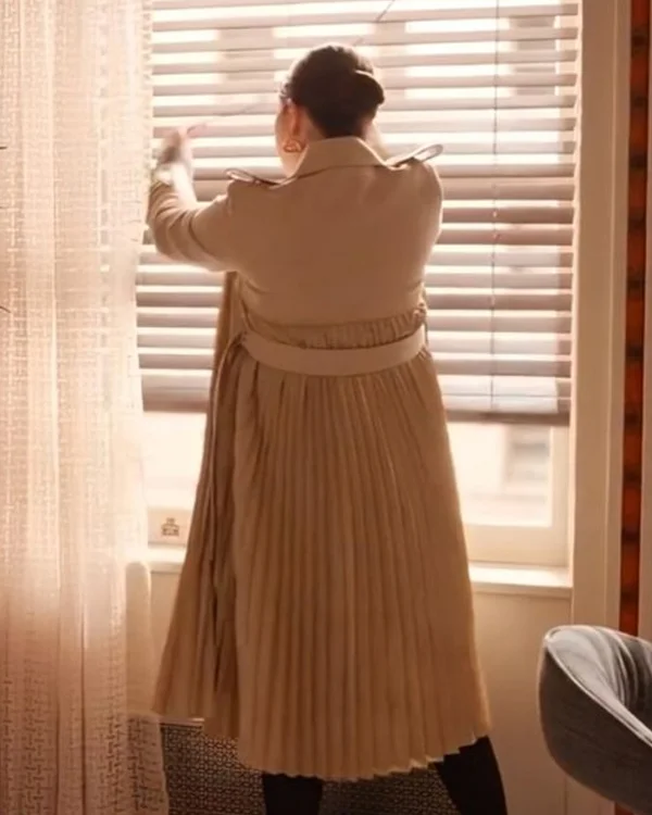 19 Only Murders in the Building S04 Selena Gomez Pleated Coat <strong>Product Specification</strong> <ul> <li>Material: Cotton Material</li> <li>Internal: Soft Viscose Fabric Lining</li> <li>Collar: Shirt Style Collar with Shoulder Loops</li> <li>Sleeves: Long Buttoned Strap Sleeves</li> <li>Cuffs: Open Hem Cuffs</li> <li>Pockets: Two Waist Pockets Outside, Two Pockets Inside</li> <li>Closure: Front Open with a Buttoned Closure</li> <li>Color: Beige</li> <li>Women’s Beige Pleated Design Trench Coat</li> </ul>