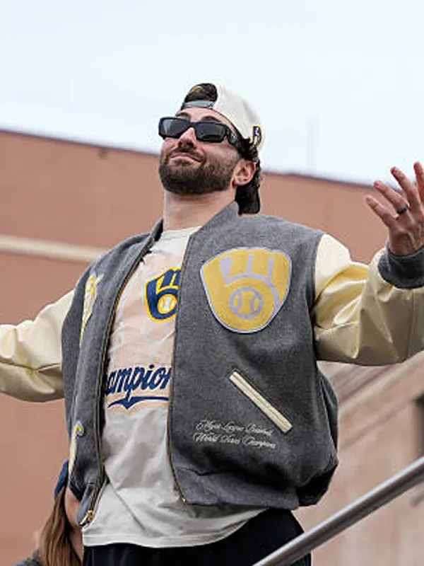 2026-Nike-Milwaukee-Brewers-Champions-Varsity-Jacket Brewers World Series Champions Destroyer Baseball Jacket <ul> <li>Material: Wool with Leather Sleeves</li> <li>Collar: Rib-Knitted Collar</li> <li>Cuffs: Rib-Knitted Cuffs</li> <li>Closure: Buttoned Closure</li> <li>Color: Gray & Cream</li> </ul>