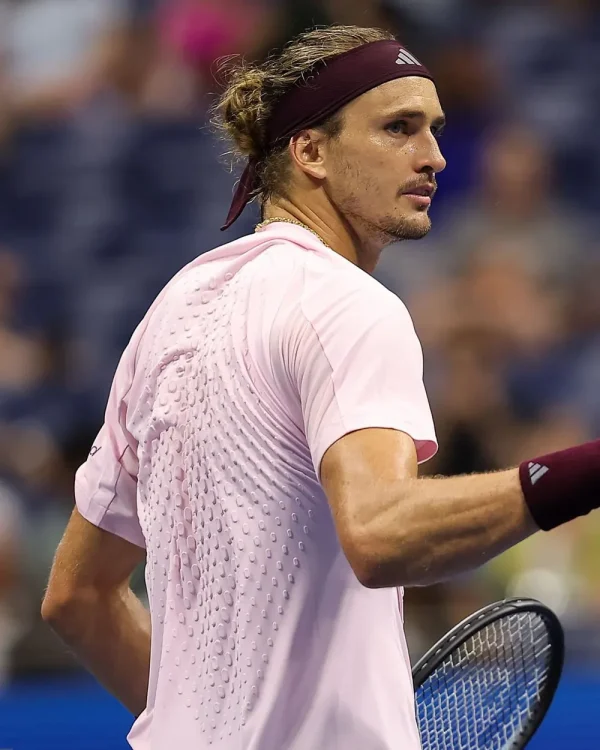Alexander-Zverev-2026-US-Open-Day-5-Pink-T-Shirt Alexander Zverev 2026 US Open Day 5 T-Shirt <strong>Product Specifications:</strong> <ul> <li>Material: Polyester</li> <li>Collar: Round Neck</li> <li>Sleeves: Short Sleeves</li> <li>Hem: Straight Athletic Hem</li> <li>Closure: Pullover</li> <li>Color: Pale Pink</li> </ul>