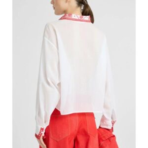 Areena Design <h2><strong>Product Specifications:</strong></h2> <ul> <li>Material: Cotton Fabric</li> <li>Collar: Shirt Style Collar</li> <li>Closure: Buttoned Style Fastening</li> <li>Sleeves: Short</li> <li>Cuffs: Open Hem Cuffs</li> <li>Color: White</li> <li>Details: Red Embroidery</li> </ul> Emily In Paris S06 Lily Collins Red Embroidered Shirt <h2><strong>Product Specifications:</strong></h2> <ul> <li>Material: Cotton Fabric</li> <li>Collar: Shirt Style Collar</li> <li>Closure: Buttoned Style Fastening</li> <li>Sleeves: Short</li> <li>Cuffs: Open Hem Cuffs</li> <li>Color: White</li> <li>Details: Red Embroidery</li> </ul>