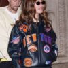 Areena Design <ul> <li>Material: Wool with Leather Sleeves</li> <li>Collar: Rib-Knitted Collar</li> <li>Cuffs: Rib-Knitted Cuffs</li> <li>Closure: Buttoned Closure</li> <li>Color: Gray & Cream</li> </ul> Hailey Bieber New York Knicks Leather Jacket <ul> <li>Material: Wool with Leather Sleeves</li> <li>Collar: Rib-Knitted Collar</li> <li>Cuffs: Rib-Knitted Cuffs</li> <li>Closure: Buttoned Closure</li> <li>Color: Gray & Cream</li> </ul>