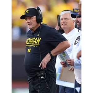 Areena Design <p>Shop the <strong>Kyle Whittingham 2026 Michigan Wolverines Black Hooded T-Shirt</strong>, crafted from premium fleece fabric in a stylish navy blue color. This T-shirt offers a comfortable fit, durable construction, and a standout look for casual wear, streetwear, fan outfits, and everyday styling.</p><ul><li><strong>Material:</strong> Fleece</li><li><strong>Color:</strong> Navy Blue</li><li><strong>Style:</strong> Comfortable, versatile, and easy to layer</li></ul> Kyle Whittingham 2026 Michigan Wolverines Black Hooded T-Shirt