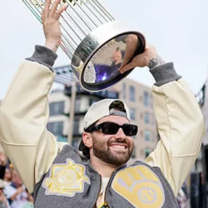 Areena Design <ul> <li>Material: Wool with Leather Sleeves</li> <li>Collar: Rib-Knitted Collar</li> <li>Cuffs: Rib-Knitted Cuffs</li> <li>Closure: Buttoned Closure</li> <li>Color: Gray & Cream</li> </ul> Brewers World Series Champions Destroyer Baseball Jacket <ul> <li>Material: Wool with Leather Sleeves</li> <li>Collar: Rib-Knitted Collar</li> <li>Cuffs: Rib-Knitted Cuffs</li> <li>Closure: Buttoned Closure</li> <li>Color: Gray & Cream</li> </ul>