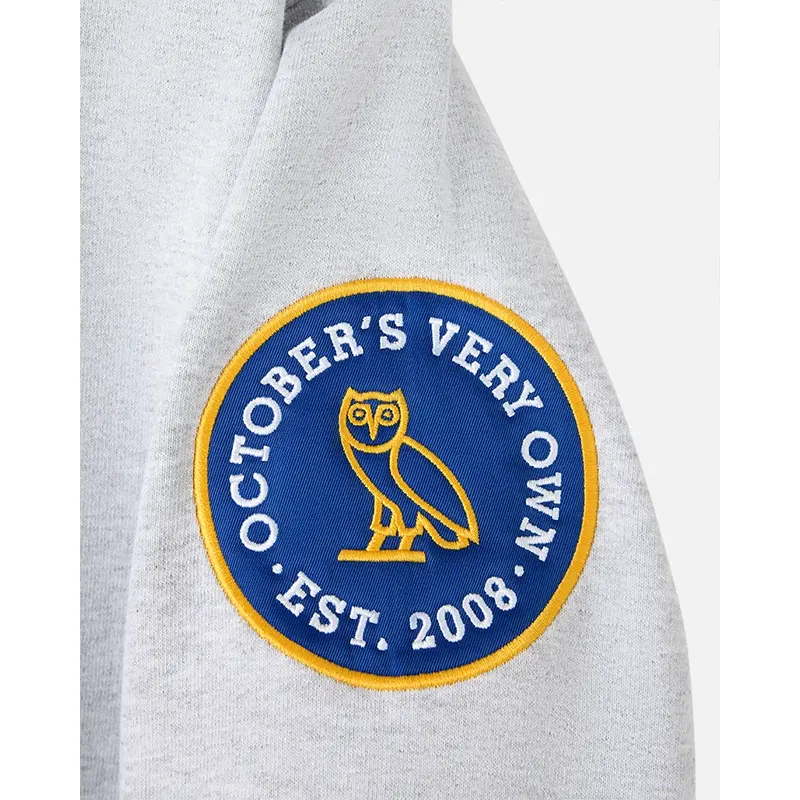 OVO Degrassi Hoodie OVO Degrassi Hoodie <p>Shop the OVO Degrassi Hoodie, a standout hoodie for fans of modern sportswear and streetwear style. Featuring a recognizable branded look, this piece is ideal for casual outfits, game-day layering, and everyday wear. Add the OVO Degrassi Hoodie to your wardrobe for a bold, versatile statement.</p>