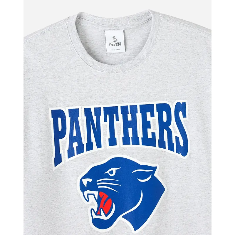OVO Degrassi Panthers Ash Heather Grey Tee 1 OVO Degrassi Panthers Ash Heather Grey Tee <p>Shop the OVO Degrassi Panthers Ash Heather Grey Tee, a statement T-shirt inspired by sport, streetwear, or fan culture. Its recognizable graphic and branded identity make it easy to style with jeans, shorts, or layered outfits. Add the OVO Degrassi Panthers Ash Heather Grey Tee to your rotation for comfortable-looking, versatile everyday style.</p>