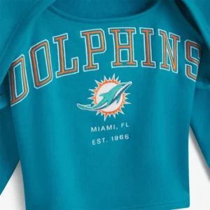 Areena Design <p>Show your team pride in the Aqua Fleece Off Season x NFL Miami Dolphins Shrug Cami with comfortable everyday style, versatile layering, and a confident fan-focused f</p> Off Season x NFL Miami Dolphins Aqua Fleece Shrug Cami