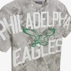 Areena Design <p>Show your team pride in this Gray Cotton T-shirt. Soft, versatile, and easy to style, it brings comfortable team spirit to game days, casual weekends, travel, and everyday layering with a polished athletic finish.</p> Off Season x NFL Philadelphia Eagles Camo Graphic T-Shirt