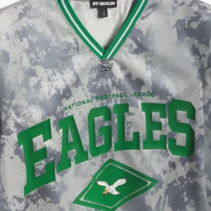 Areena Design <p>Show your team pride in this Gray Polyester top. Soft, versatile, and easy to style, it brings comfortable team spirit to game days, casual weekends, travel, and everyday layering with a polished athletic finish.</p> Off Season x NFL Philadelphia Eagles Camo Mesh Long Sleeve V-Neck Top