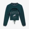 Areena Design <p>Show your team pride in the Navy Fleece Off Season x NFL Denver Broncos Shrug Cami with comfortable everyday style, versatile layering, and a confident fan-focused f</p> Off Season x NFL Philadelphia Eagles Shrug Cami
