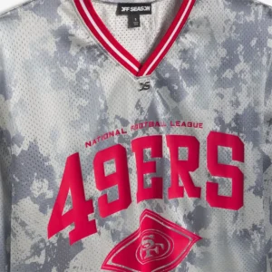 Areena Design <p>Show your team pride in this Gray Polyester top. Soft, versatile, and easy to style, it brings comfortable team spirit to game days, casual weekends, travel, and everyday layering with a polished athletic finish.</p> Off Season x NFL San Francisco 49ers Camo Mesh Long Sleeve V-Neck Top